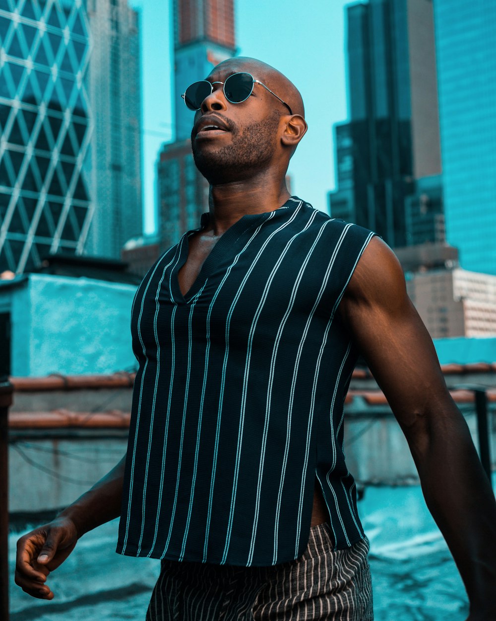 man standing beside buildings