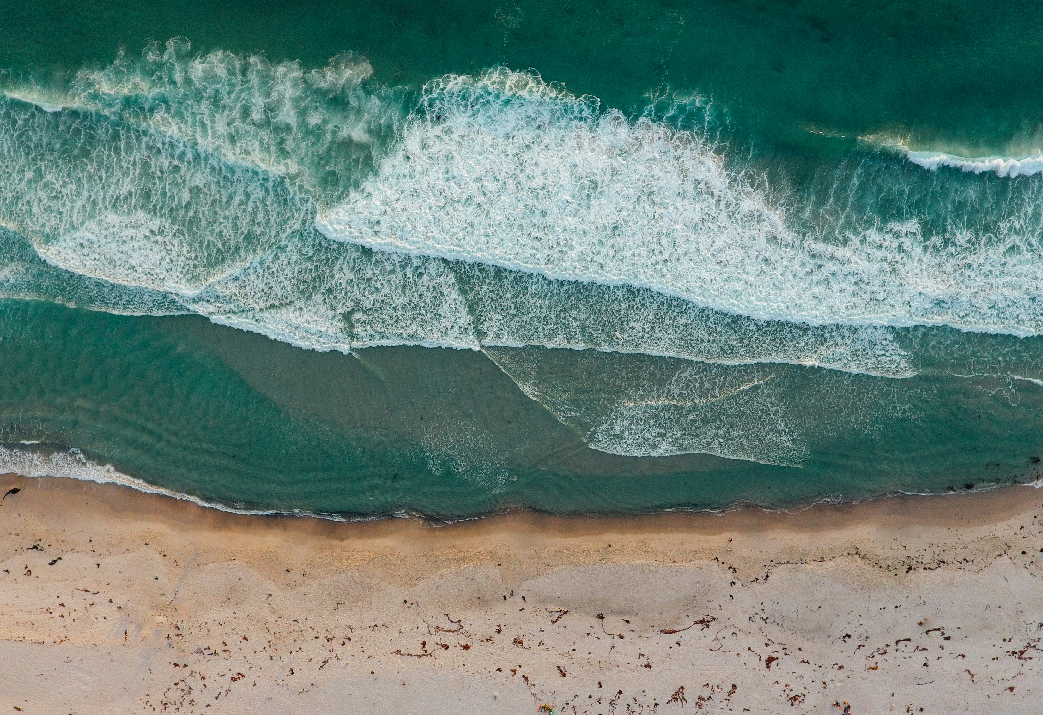 I took the drone out to the beach one day. The lighting was incredible and the water was a s blue as can be. There were a few people out on this particular beach. The beach was a bit down the coast so it was off the beaten path just a bit. I took the drone out of the car and got it prepped to fly. The sunwas hitting the water and sand int he most perfect way. Next thing I knew, the drone was up in the air at about 350’. I wanted to enjoy the scenery more the then tech i had to capture it. 

Email me if you use this. I want to see what you do with it! george@coxstudios.net

Cheers