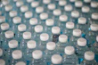 Large water containers stacked and ready for delivery in a clean warehouse setting.