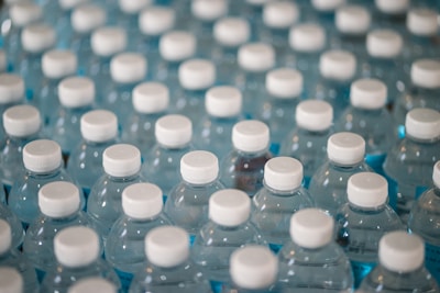 Storage area filled with stacks of bottled water ready for distribution.