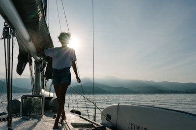 woman standing on boat at daytime