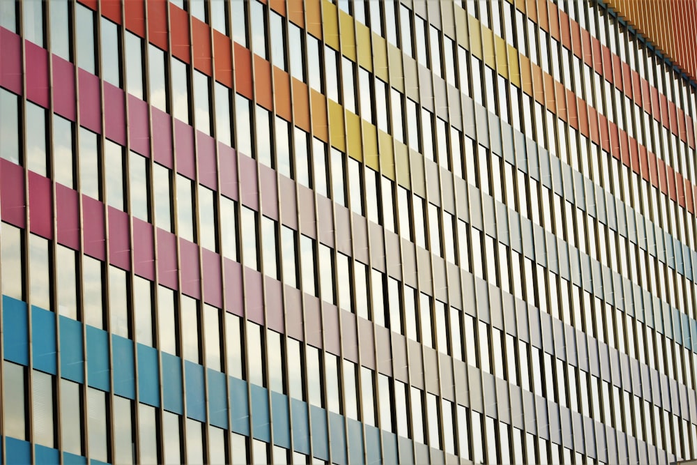 a colorful building with a clock on the side of it