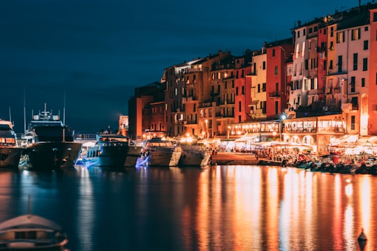 boats docket on port near row buildings in Portovenere Italy