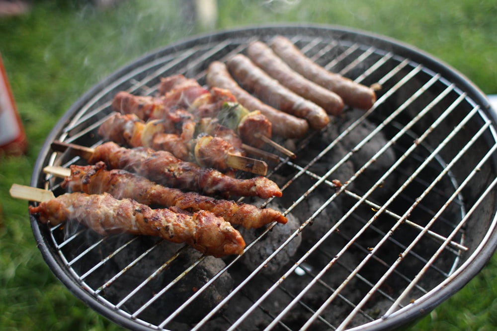 barbecue and sausage on round grill