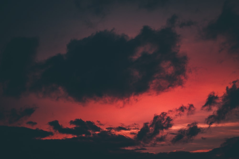 selective focus photo of red sky and gray clouds