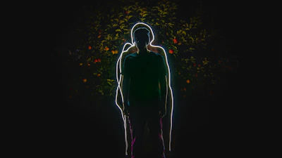 A whimsical character sketch mid-motion, glowing softly against a dark backdrop.