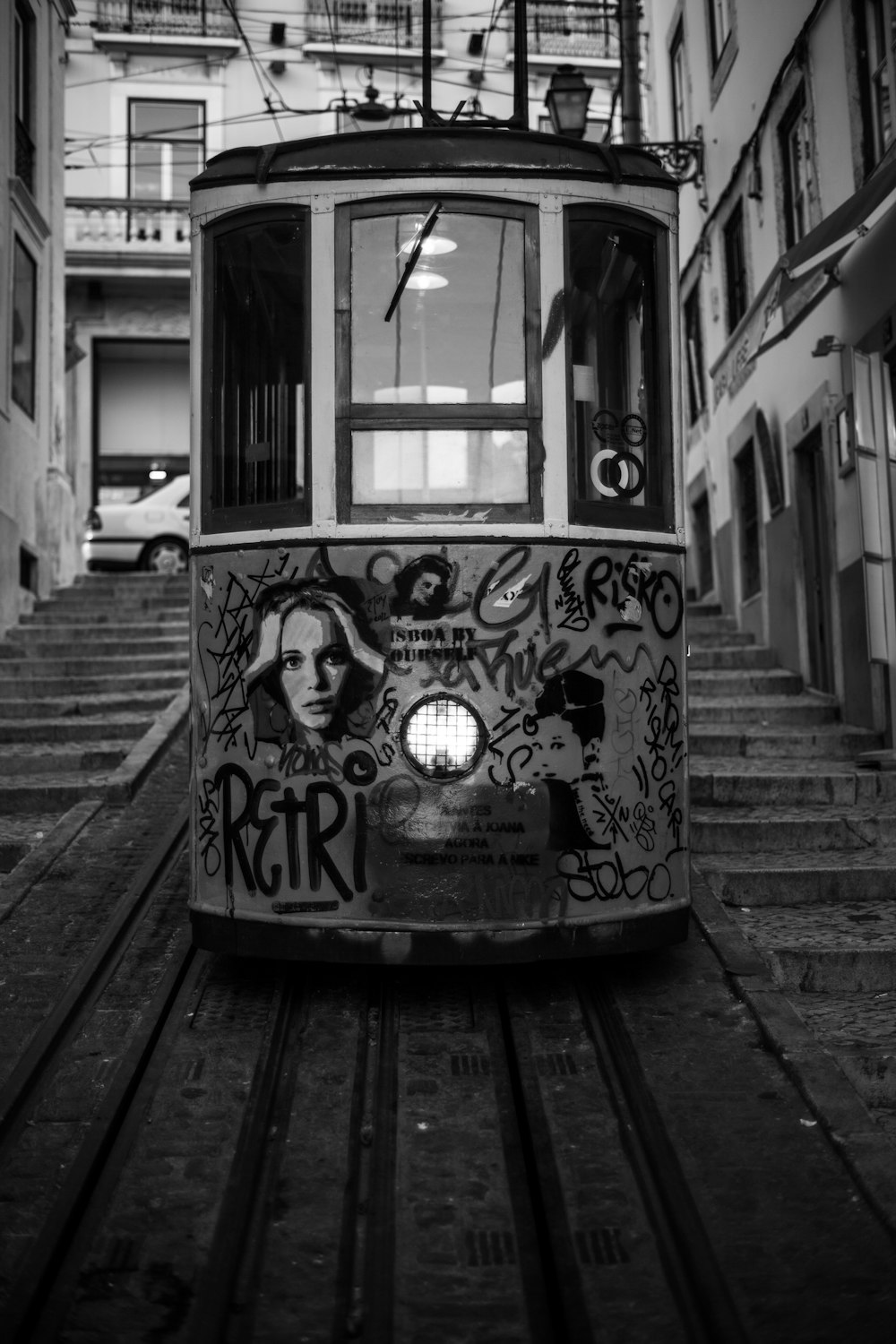 grayscale photo of a cable car with print