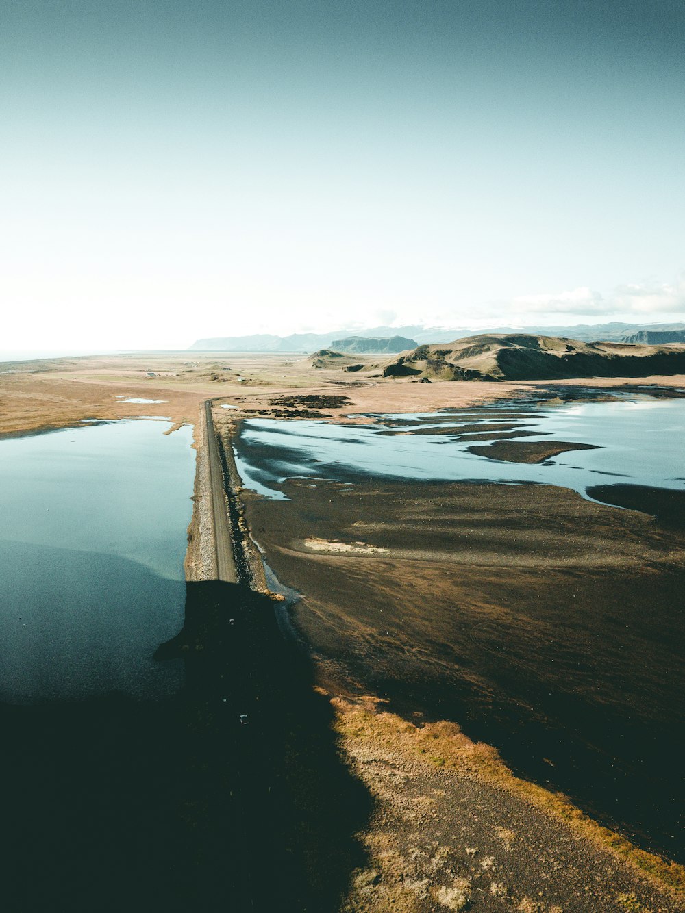 aerial photography of land near body of water