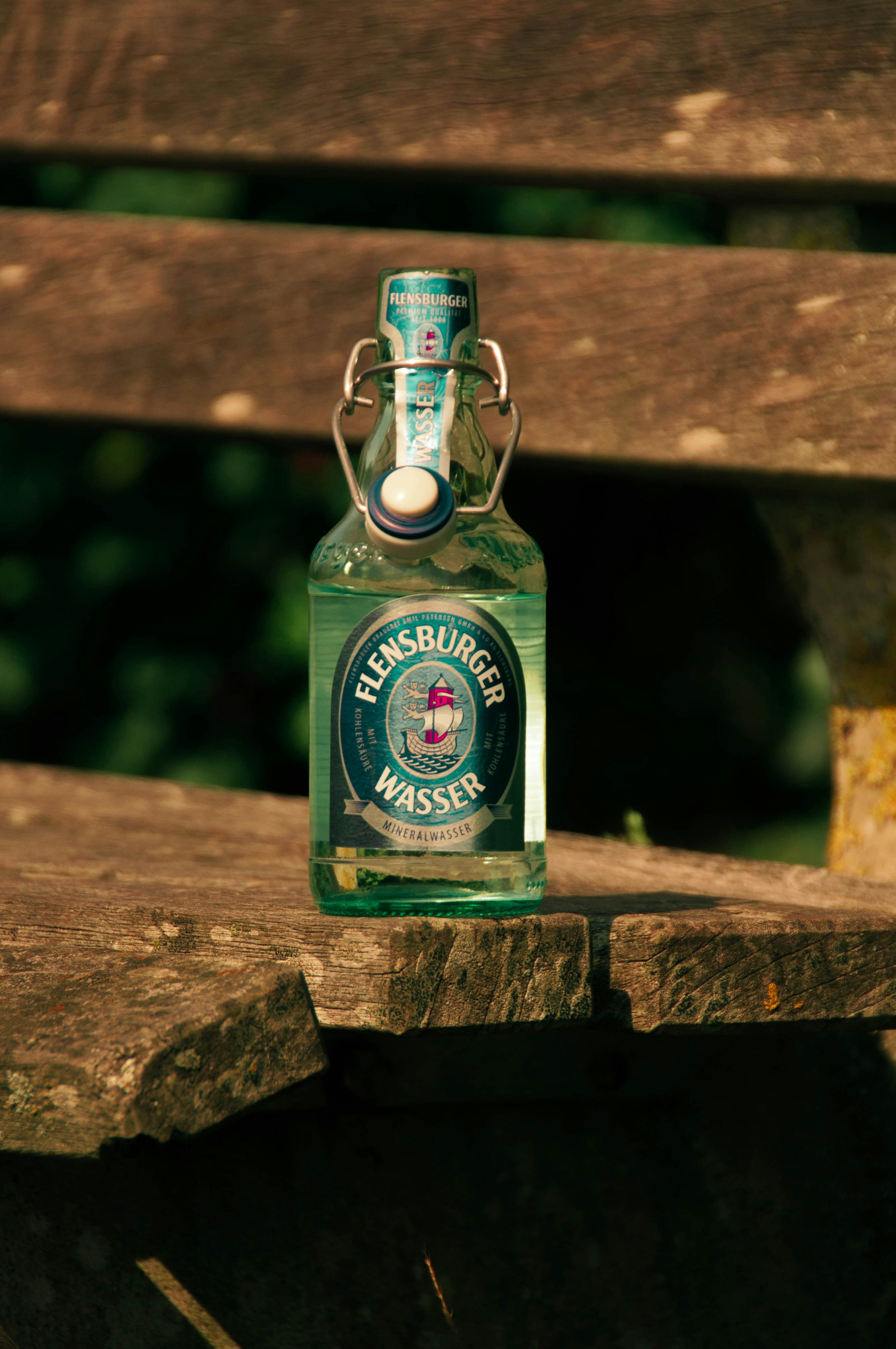 closed Flensburger Wasser bottle on bench