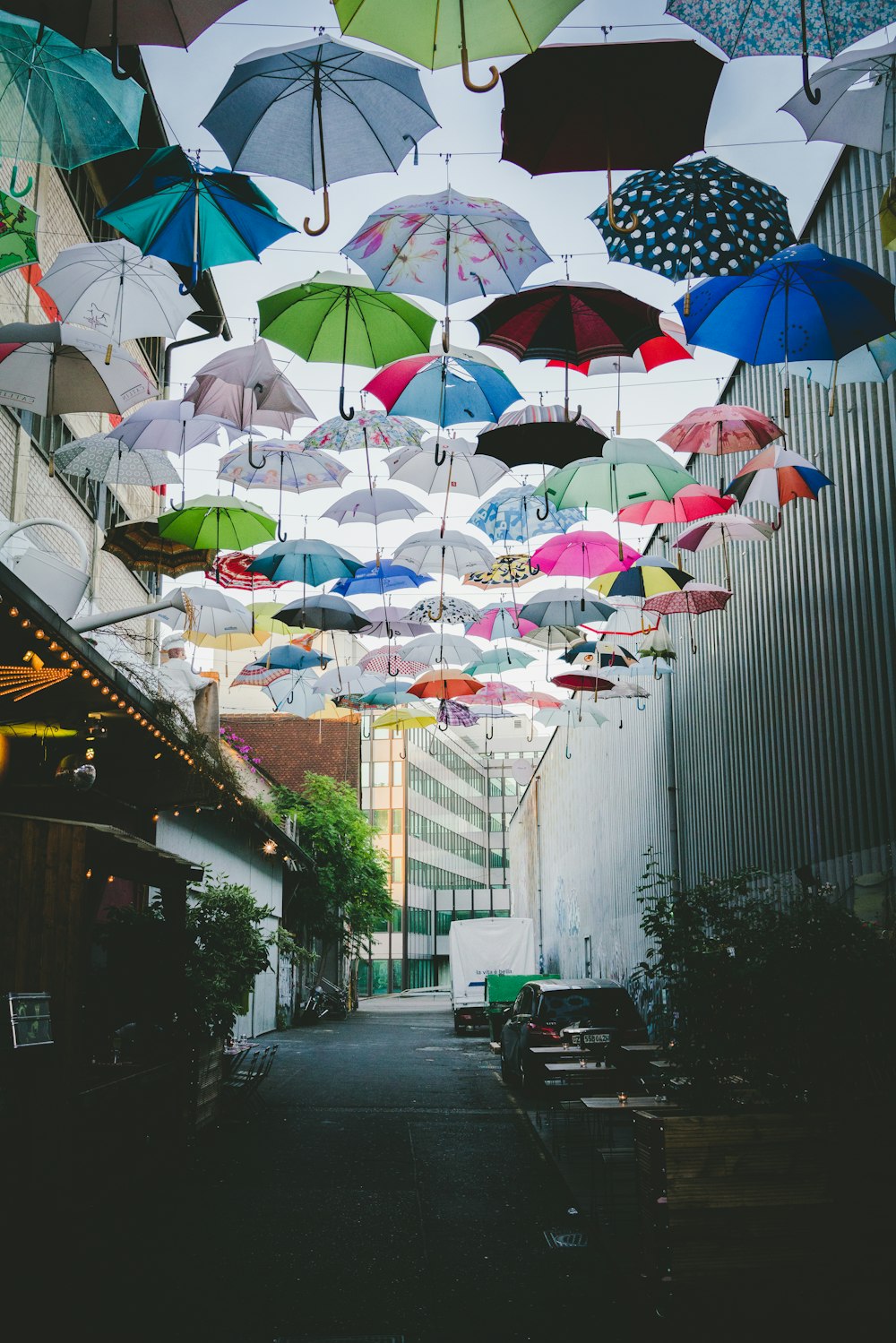 assorted-colored umbrella lot under blue sky during daytime