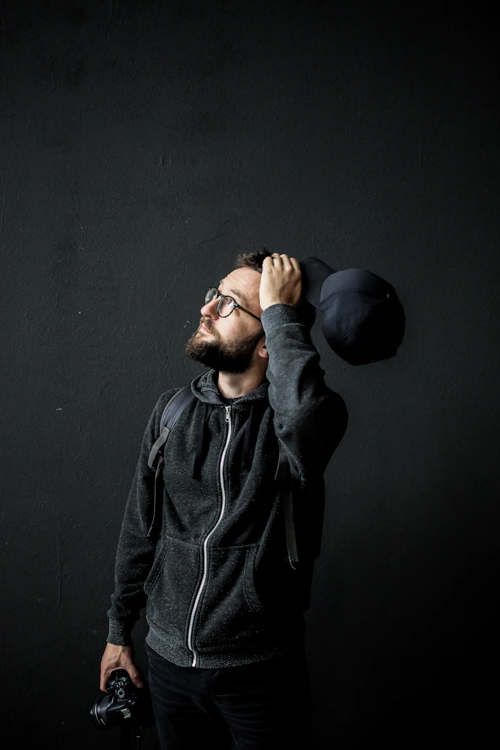 Man looking up with a hand in his hair