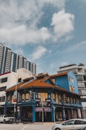 A historic building with intricate architecture in a vibrant neighborhood.