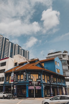 A historic building with intricate architecture in a vibrant neighborhood.