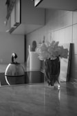 A tidy kitchen counter with a simple vase of fresh flowers and morning light.