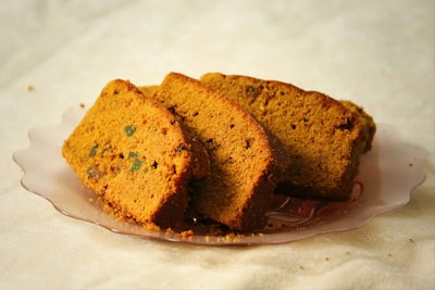 sliced cakes on plate cornbread teams background