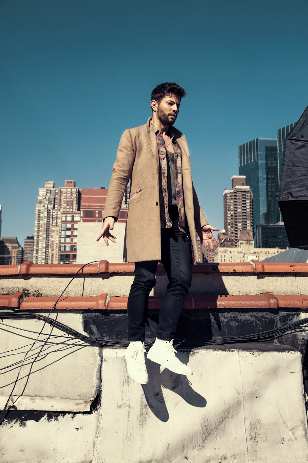 man wearing brown topcoat