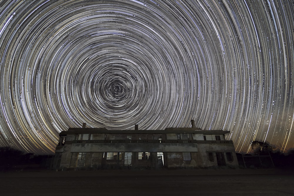 white house in front of black hole wallpaper