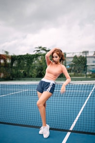 woman leaning on net