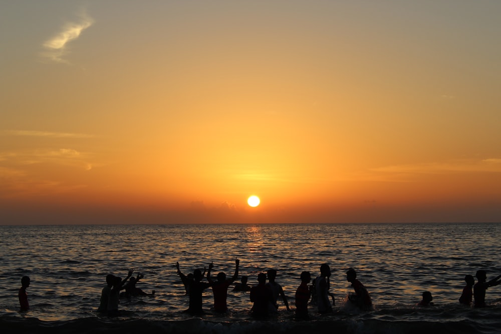 silhouette of people on beach