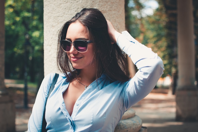 Sophisticated MILF leaning on wall