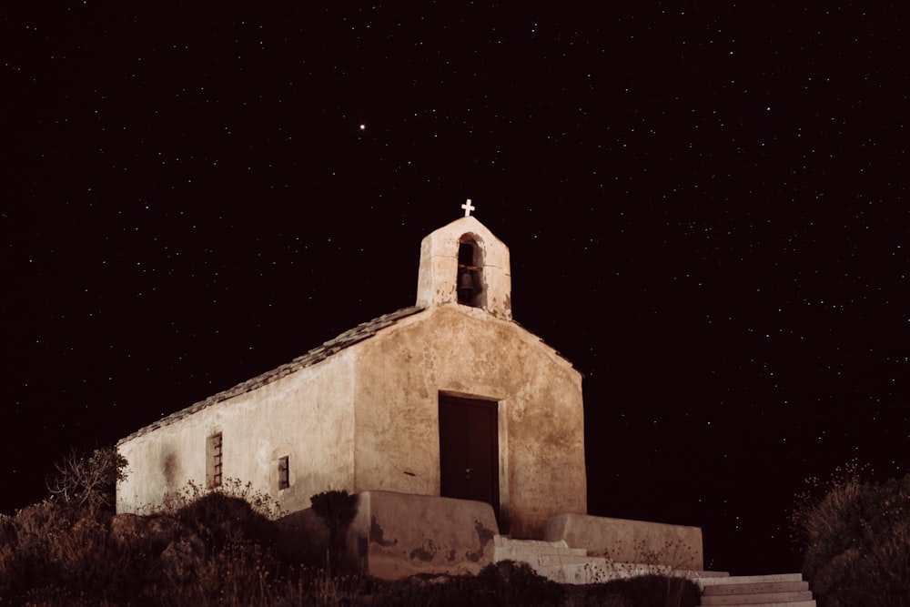 beige concrete church during nighttime