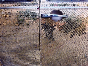 Close-up of a detailed vinyl wrap pattern on a car door.