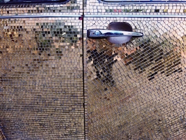 Close-up of a detailed vinyl wrap pattern on a car door.
