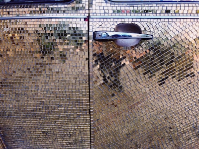 Custom design detailing on a car door, showcasing intricate patterns with precision.