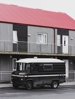 A photo of a locksmith's van parked outside a residential building.