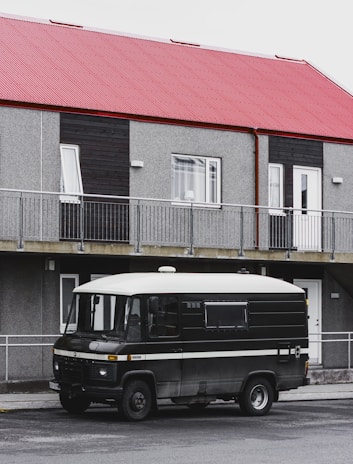 A photo of a locksmith's van parked outside a residential building.