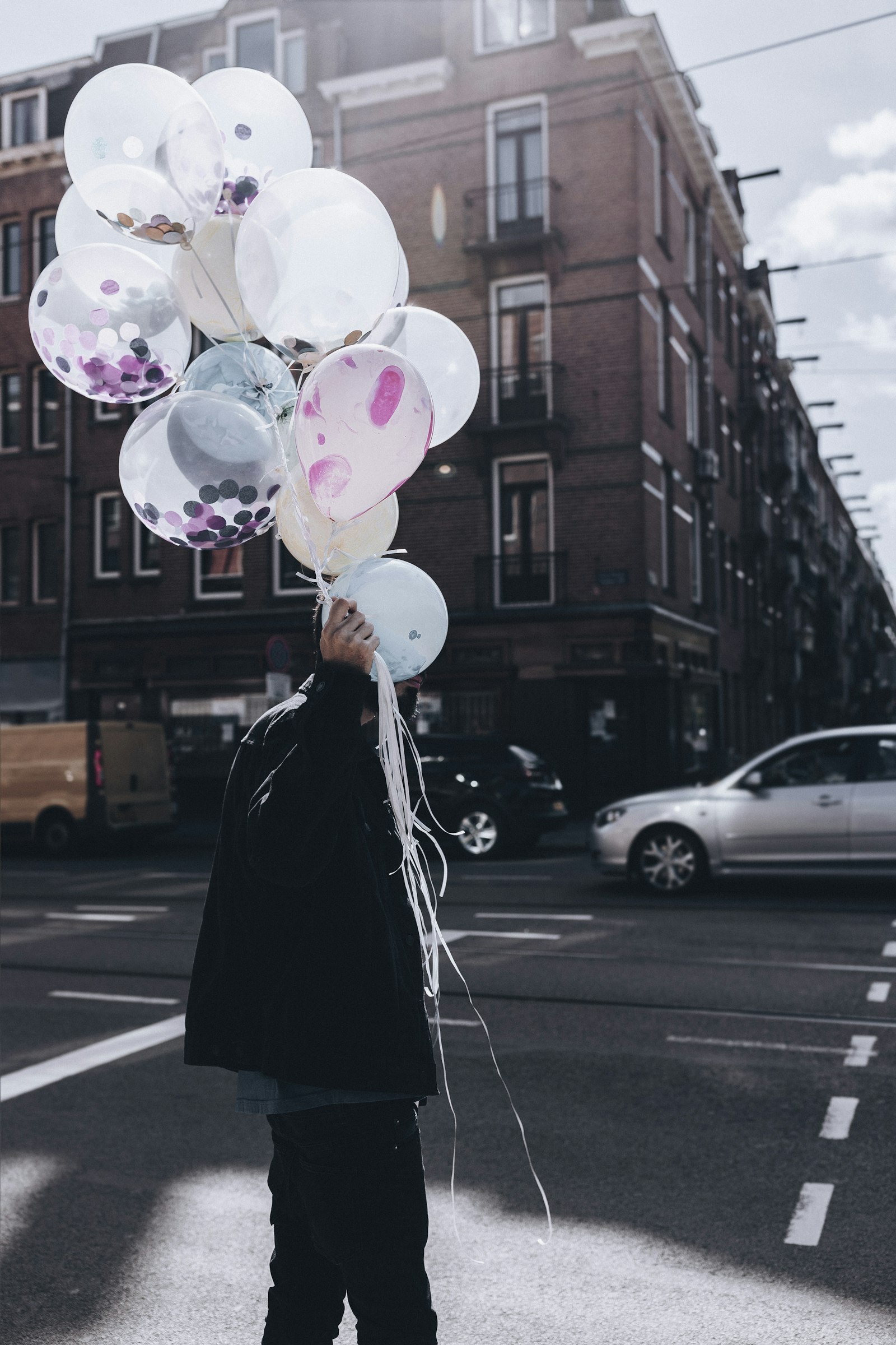 Canon EOS 6D Mark II + Canon EF 35mm F1.4L II USM sample photo. Man holding white balloon photography