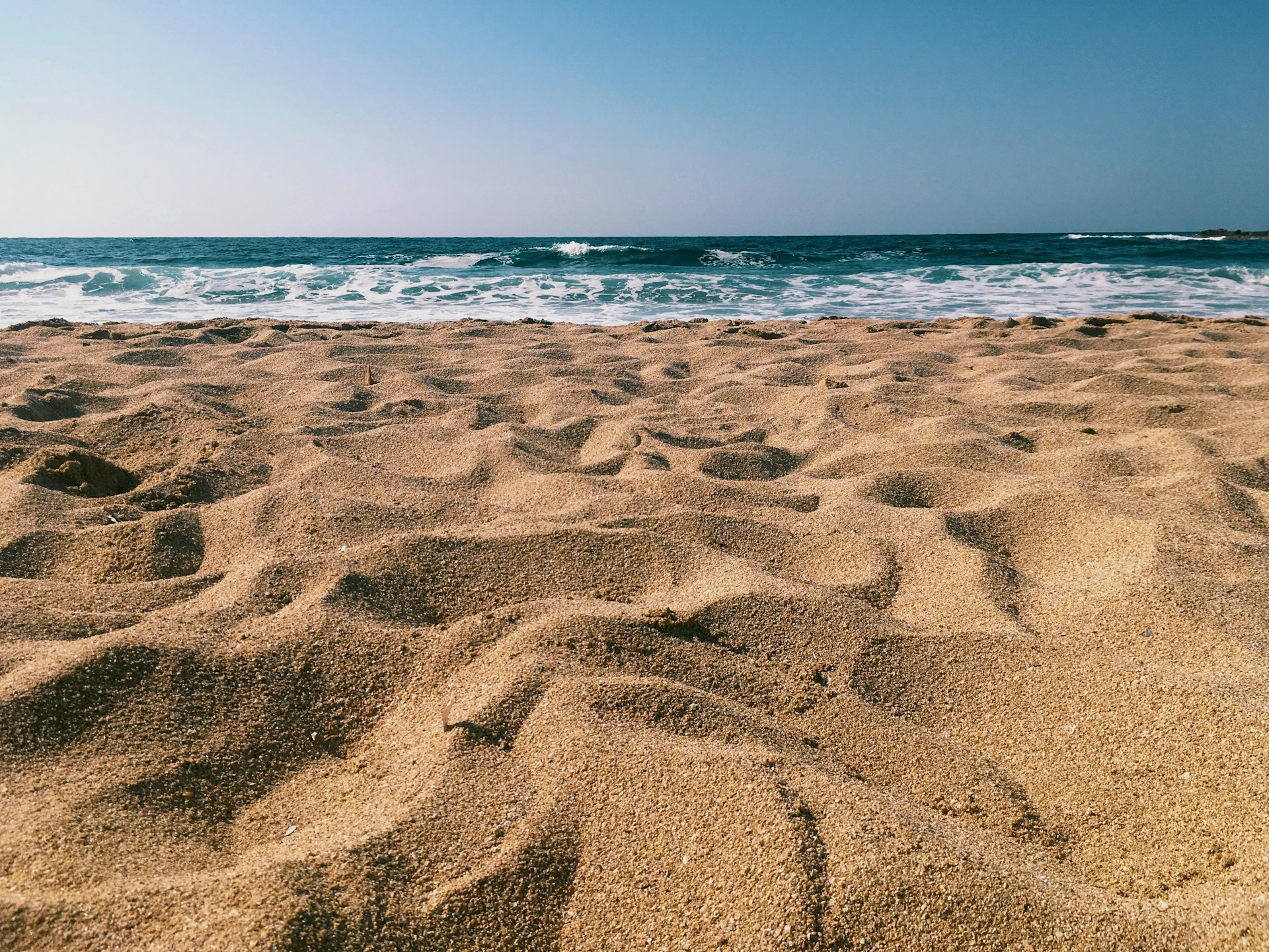brown sands near seashore at daytime