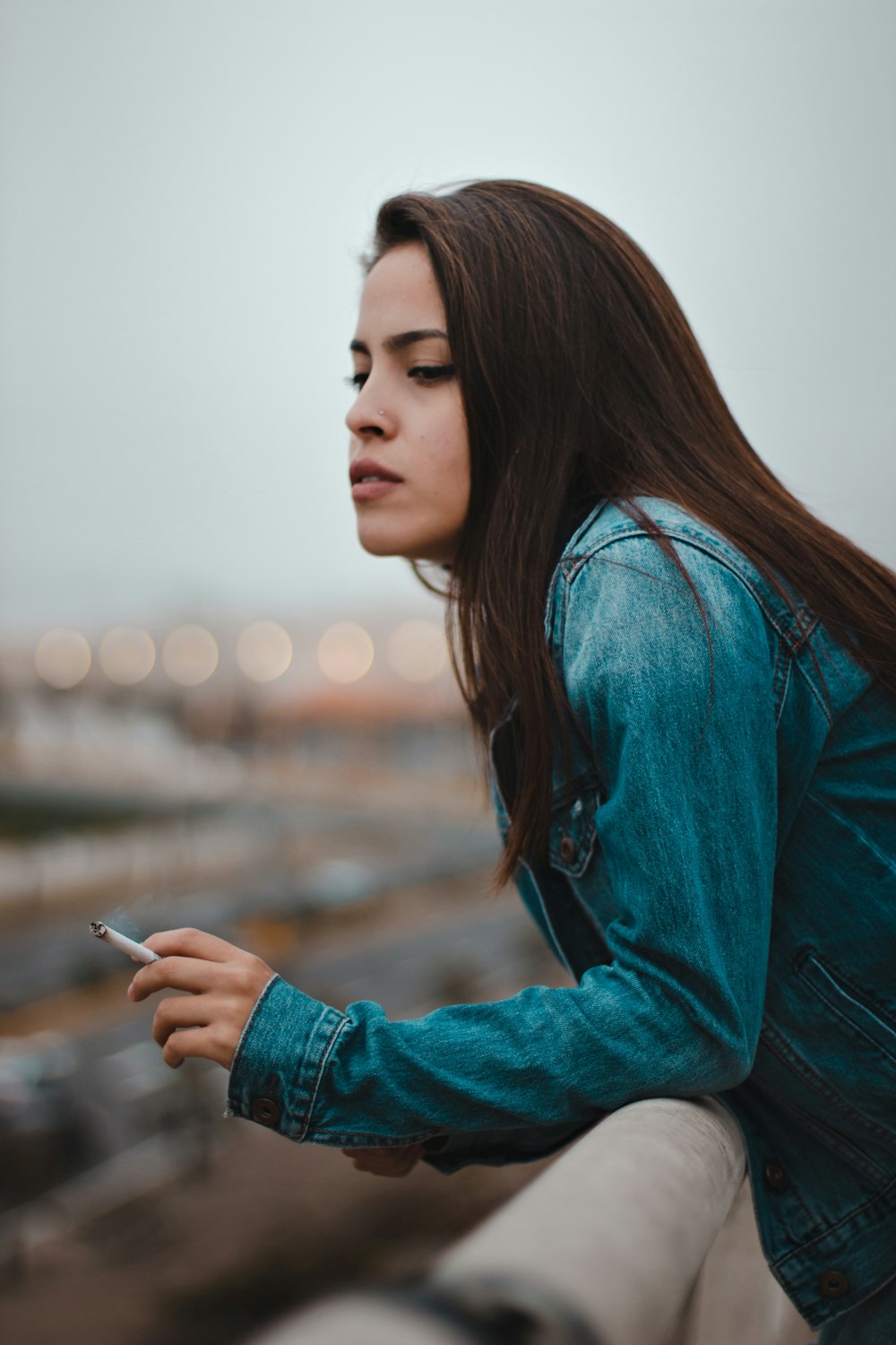 woman holding cigarette