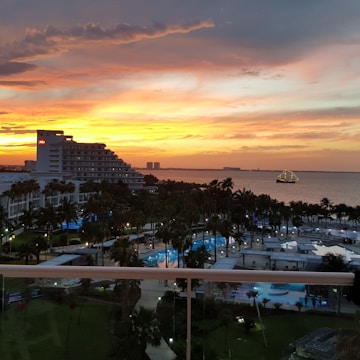 Sunset view over a coastal hotel developed by the company.