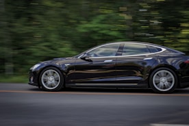 black sedan on gray concrete road