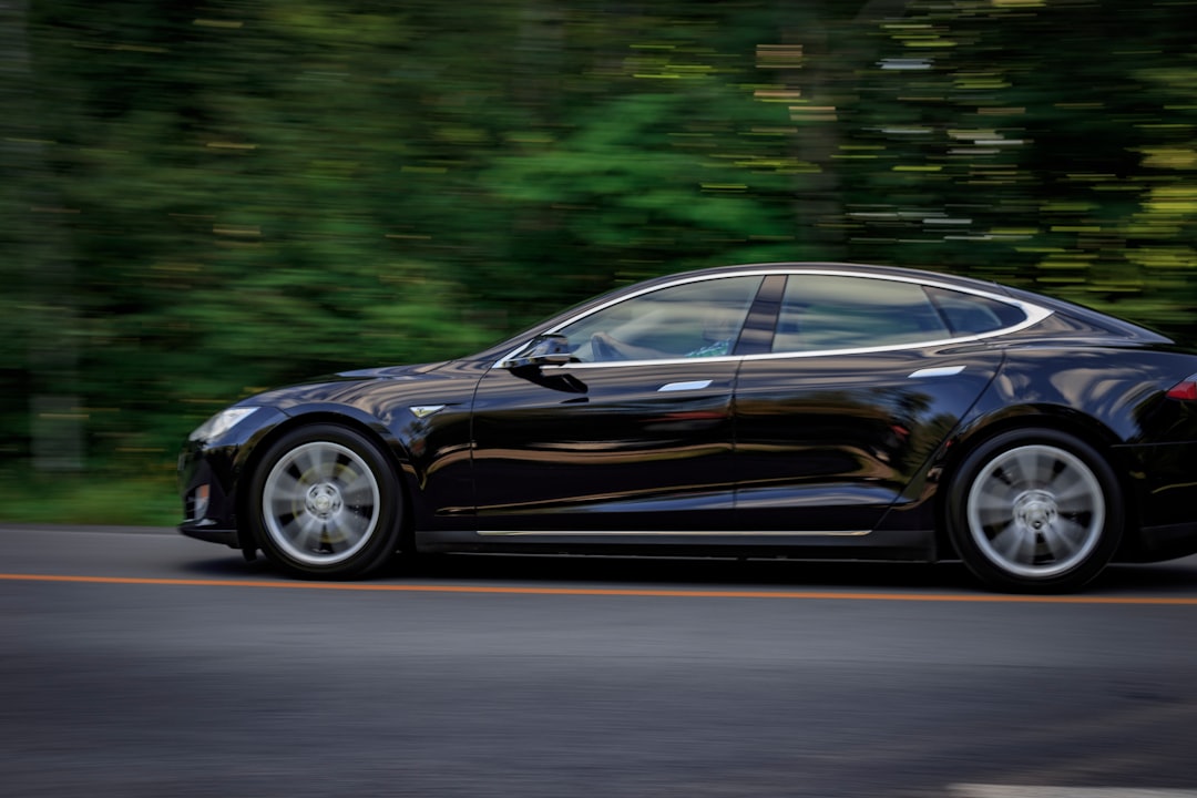 black sedan on gray concrete road