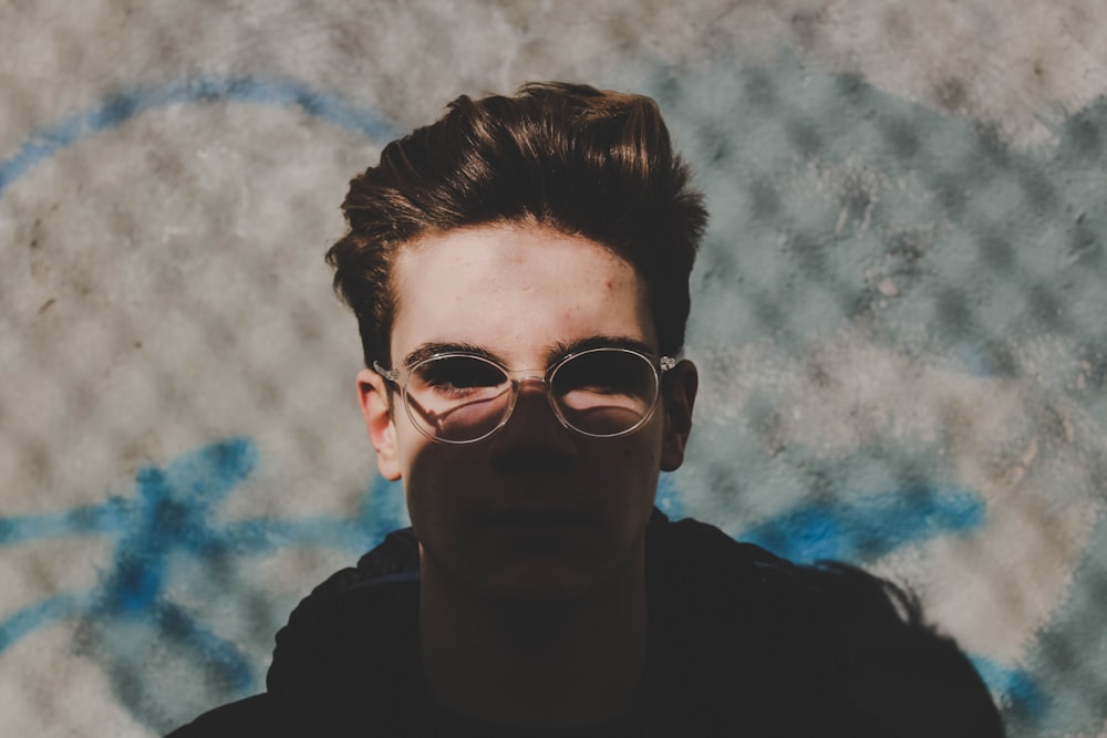 man wearing gray framed sunglasses