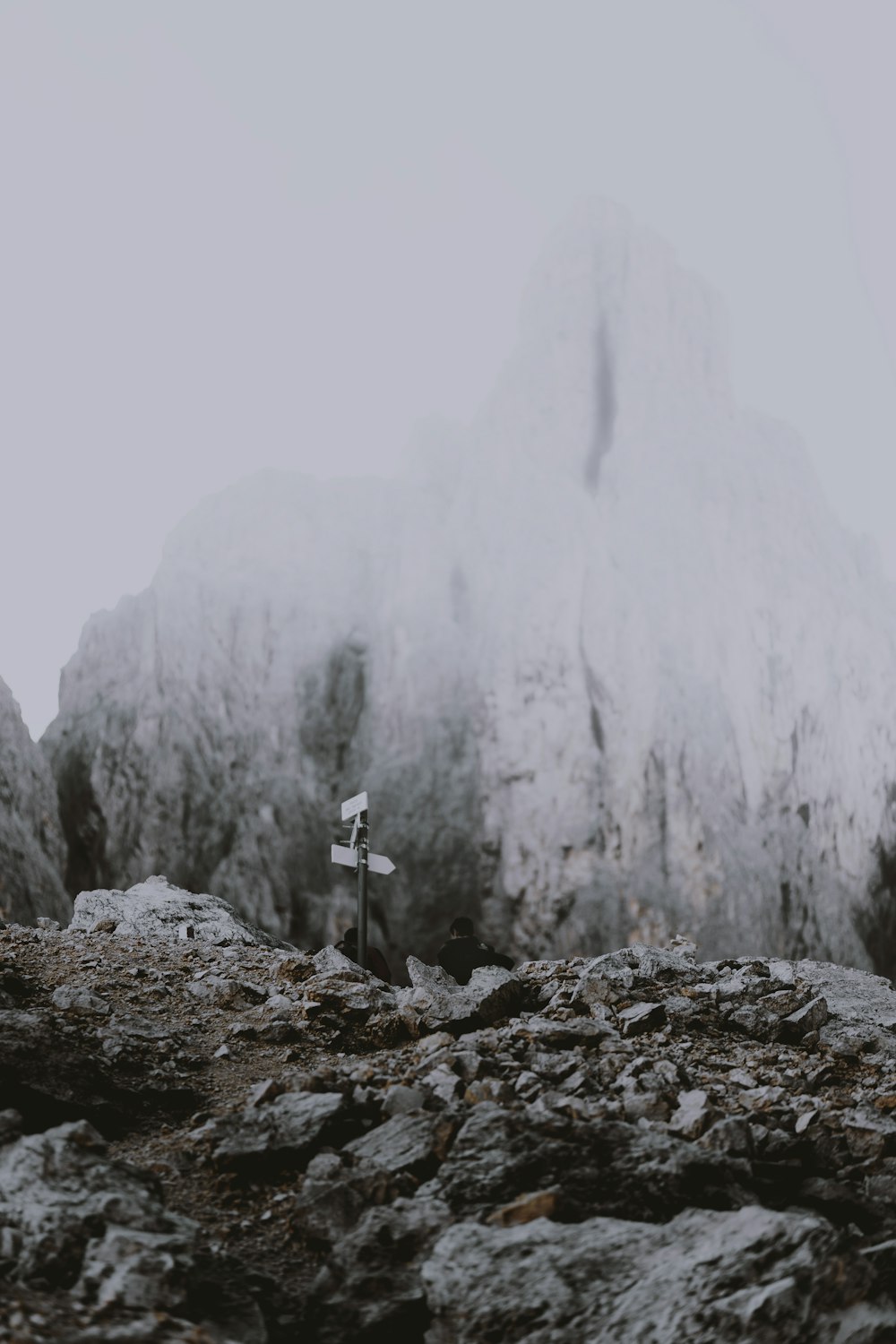 a person standing on top of a rocky mountain