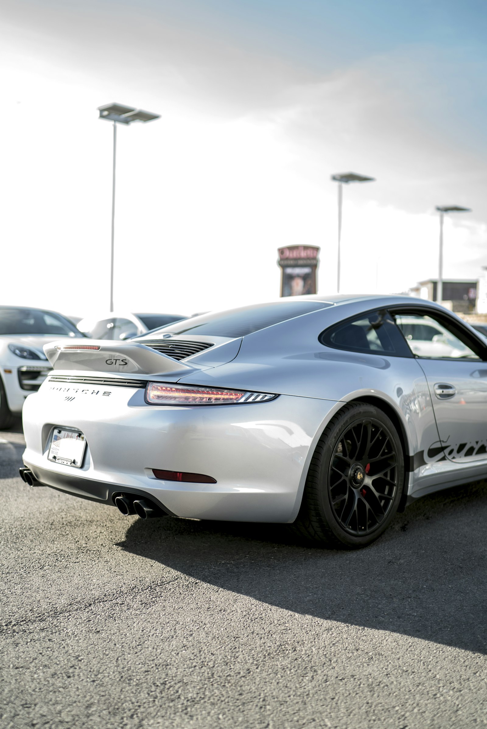 Sony a7S II + Sony Distagon T* FE 35mm F1.4 ZA sample photo. Gray sports car parked photography