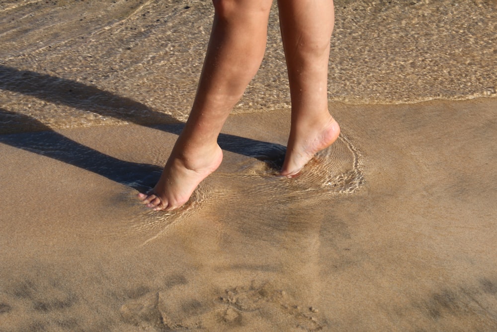 walking woman on seashore at daytime