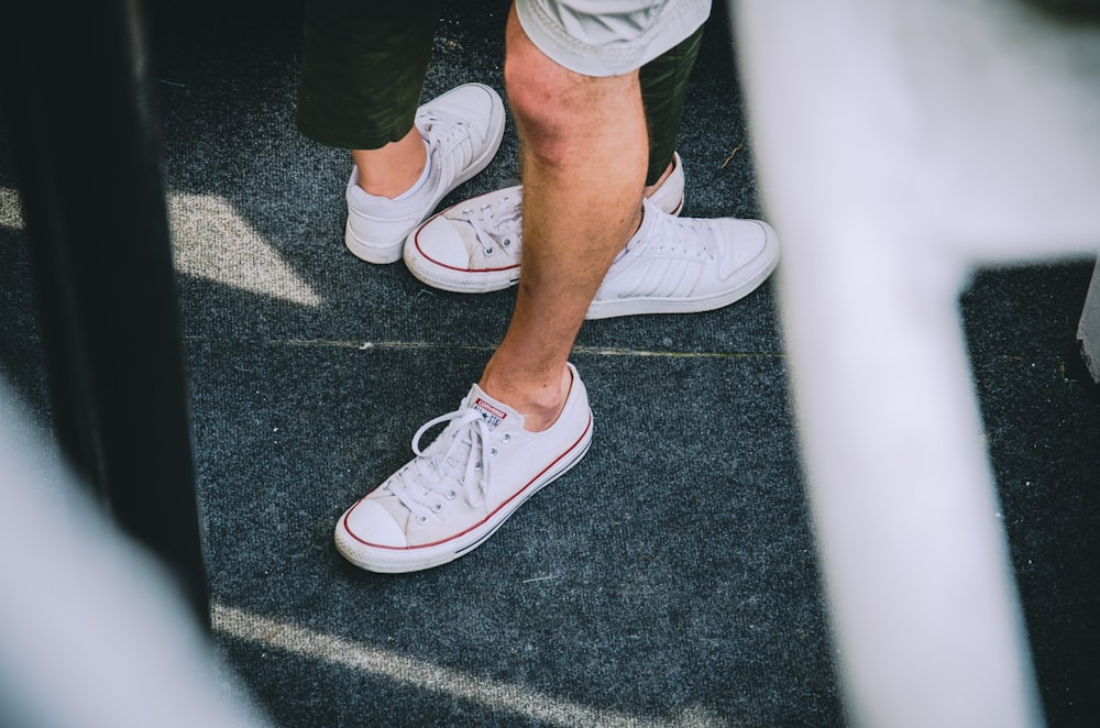 person standing on gray carpet