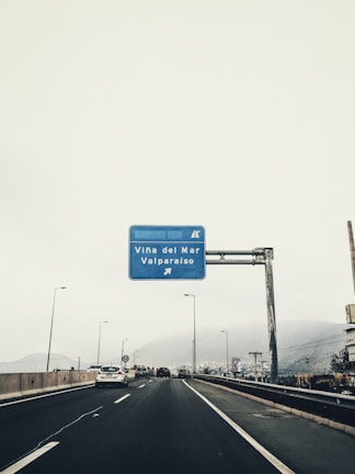 Long shot of the busy road connecting San Antonio port and Route 5 Sur near the parking.