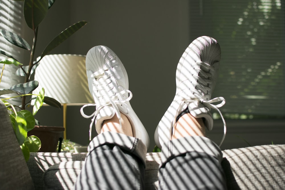 pair of white adidas superstar sneakers