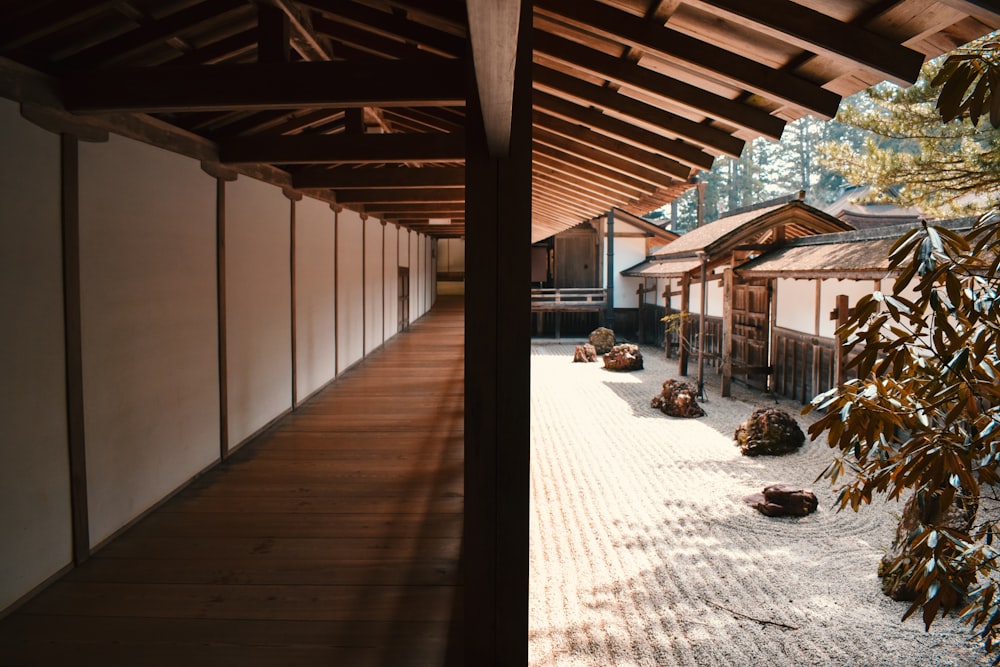 brown wooden flooring beside wall