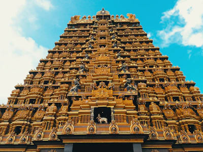 The majestic Konark Sun Temple framed by a clear blue sky.