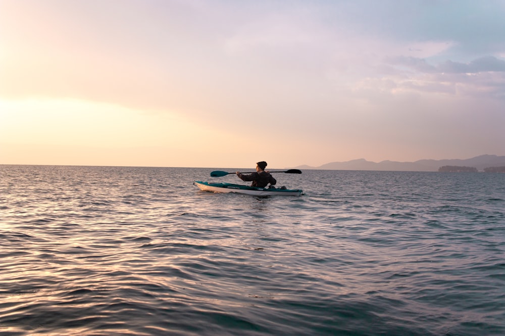 person in white boat