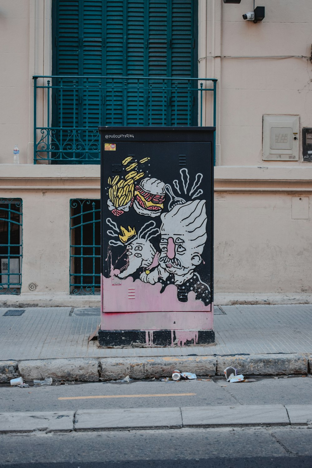 white and black man painting on road