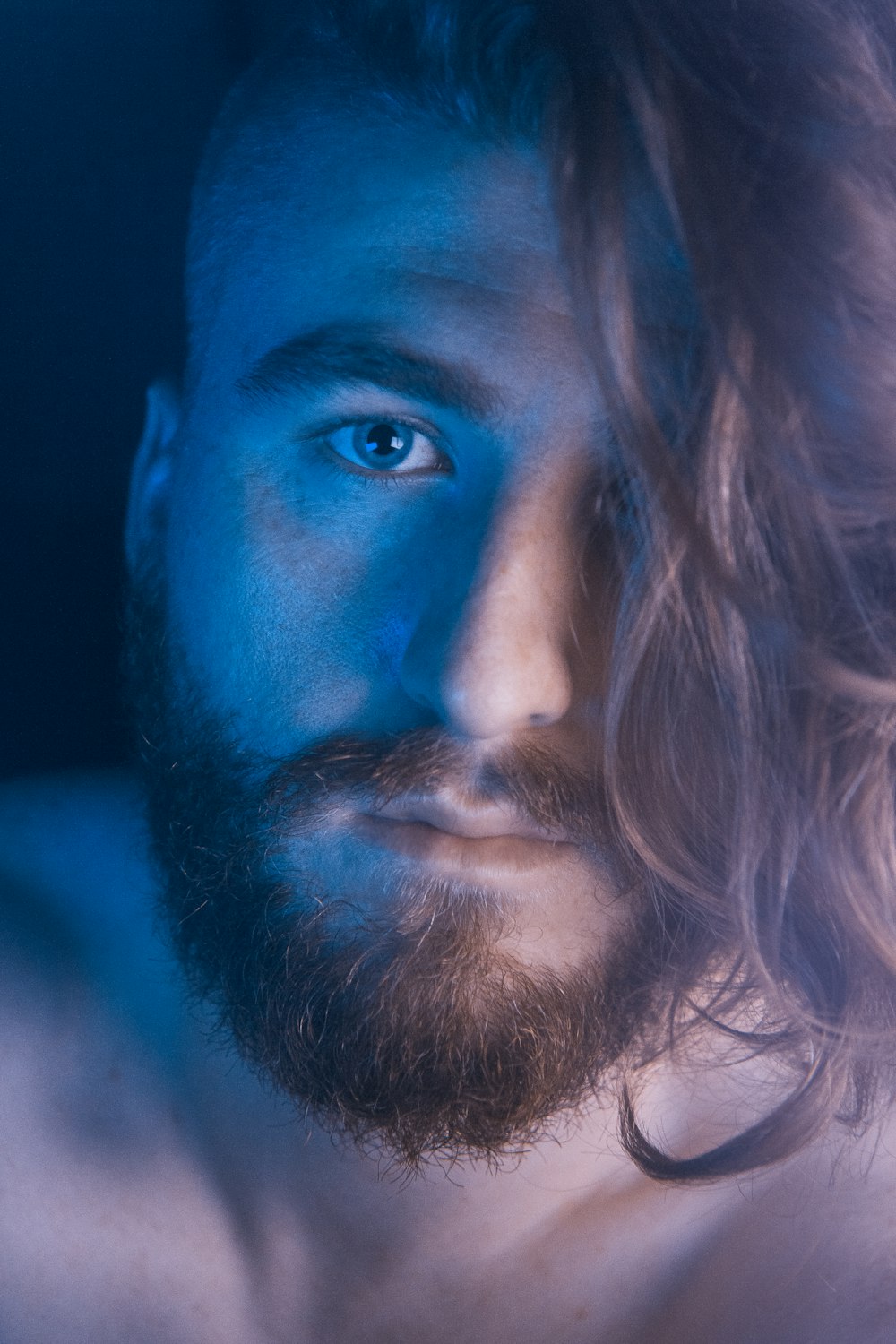 man taking selfie inside dark room