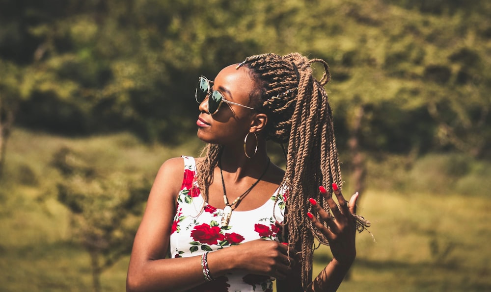 woman holding her braided hair