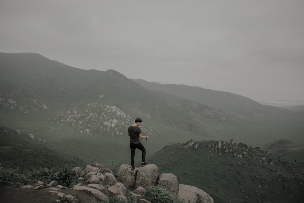 man standing on cliff